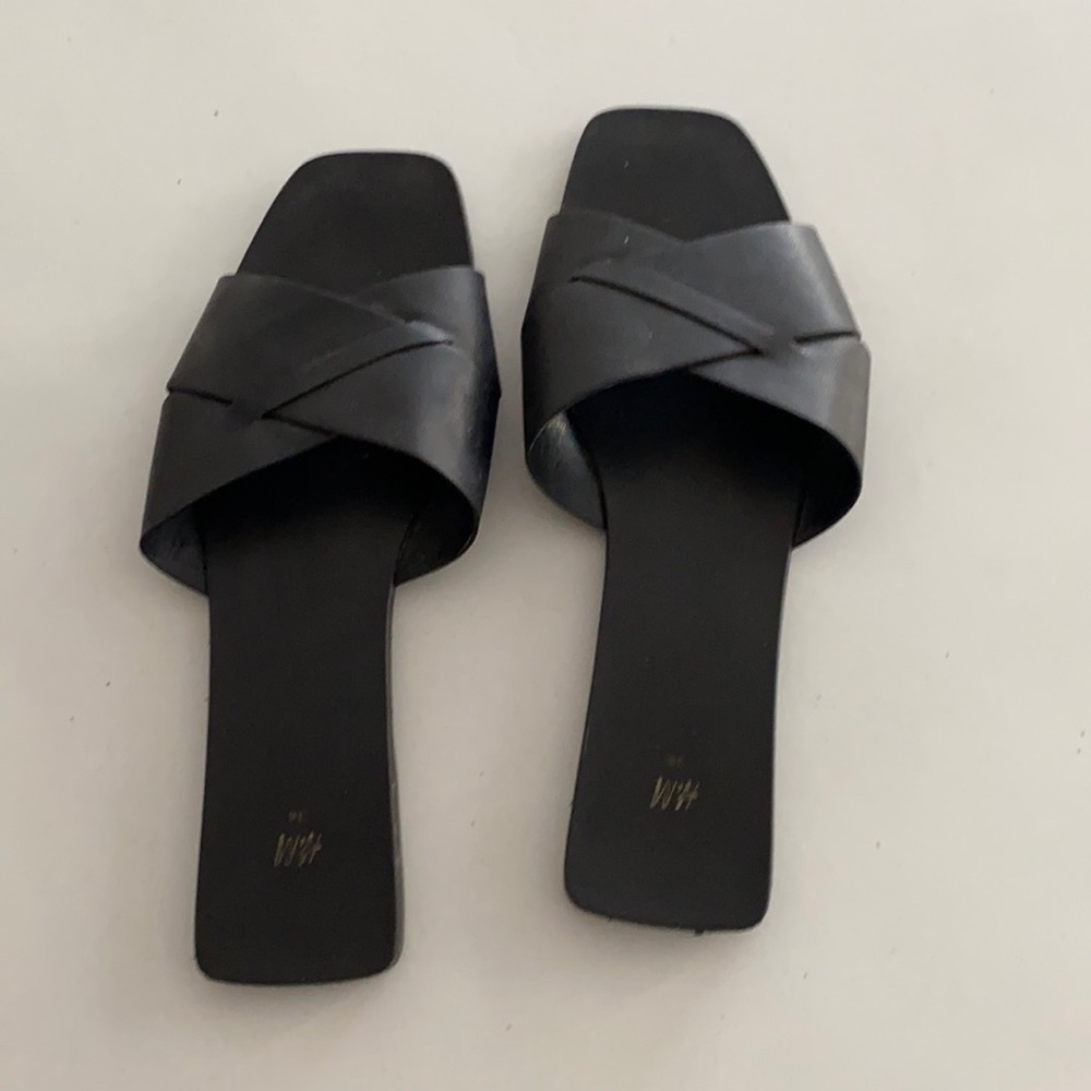 Black HM leather slides. Size 38